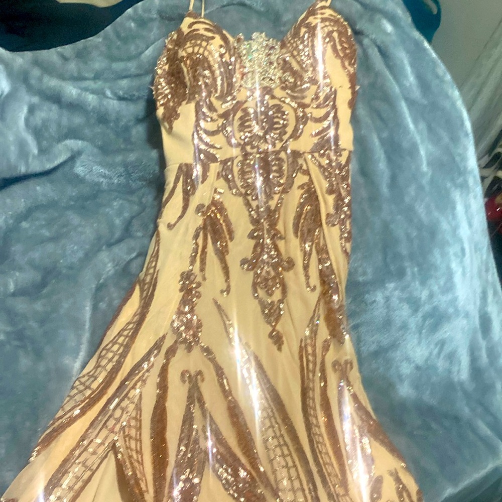 Size Medium Rose Gold Formal Dress only used once.